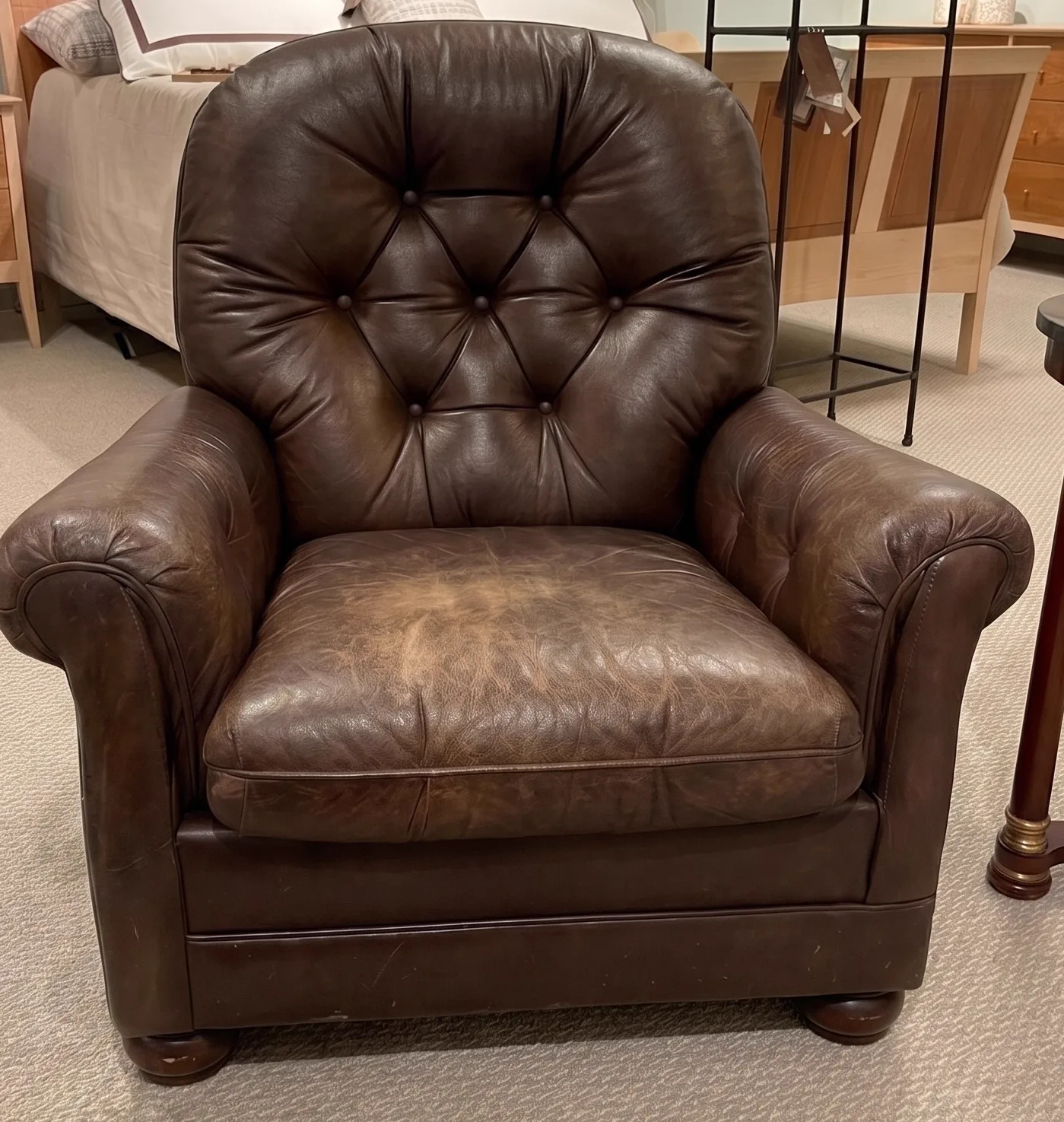 Scuffed, dry tan leather sofa before restoration